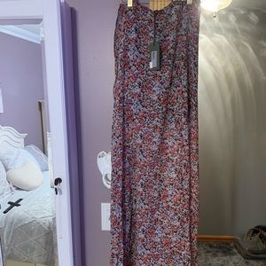 I am selling high-low brand new flowy skirt. All Saints is the brand